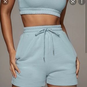 Women’s two piece sky blue set. Both a size small. No tags but never worn.